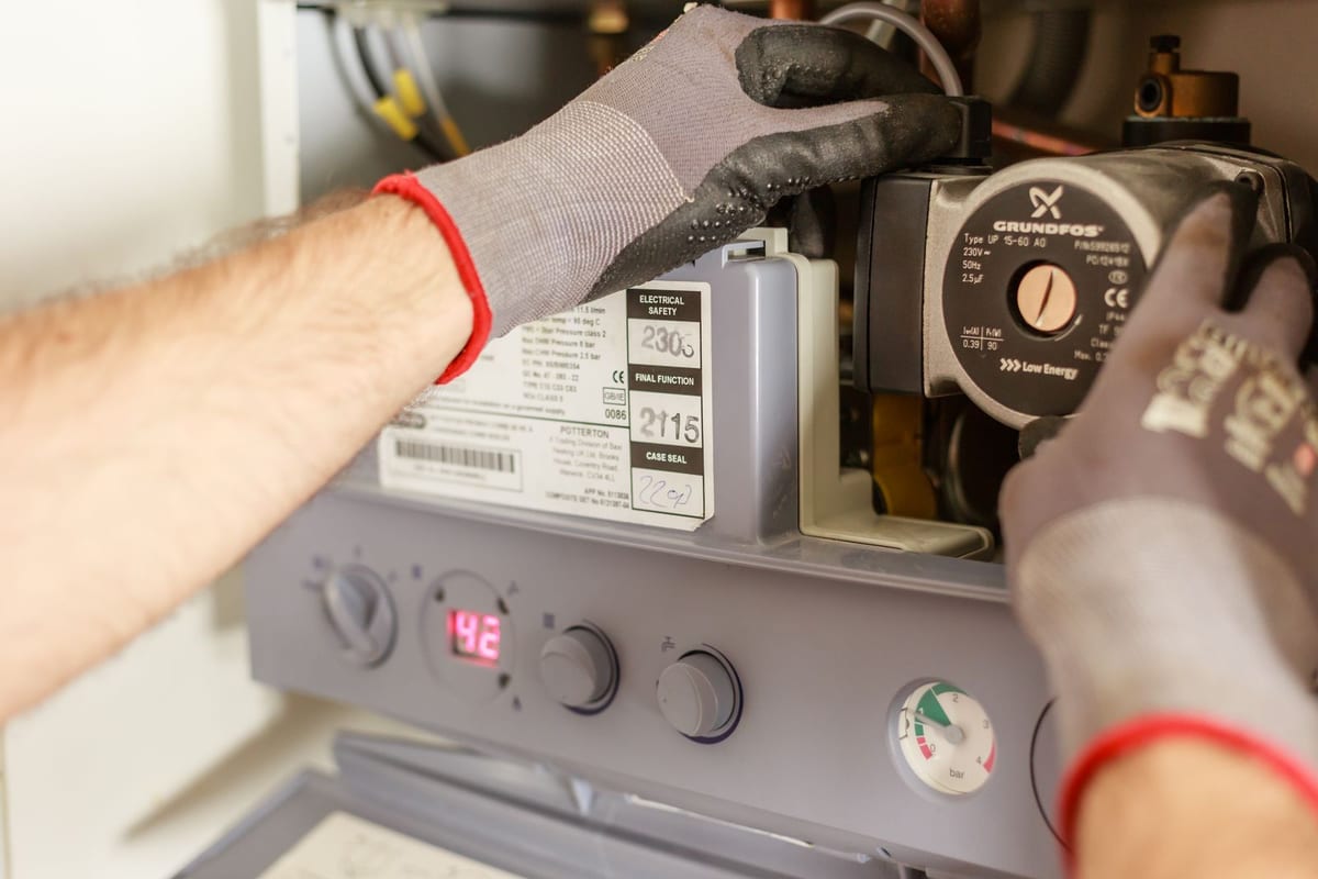 Technician servicing a furnace