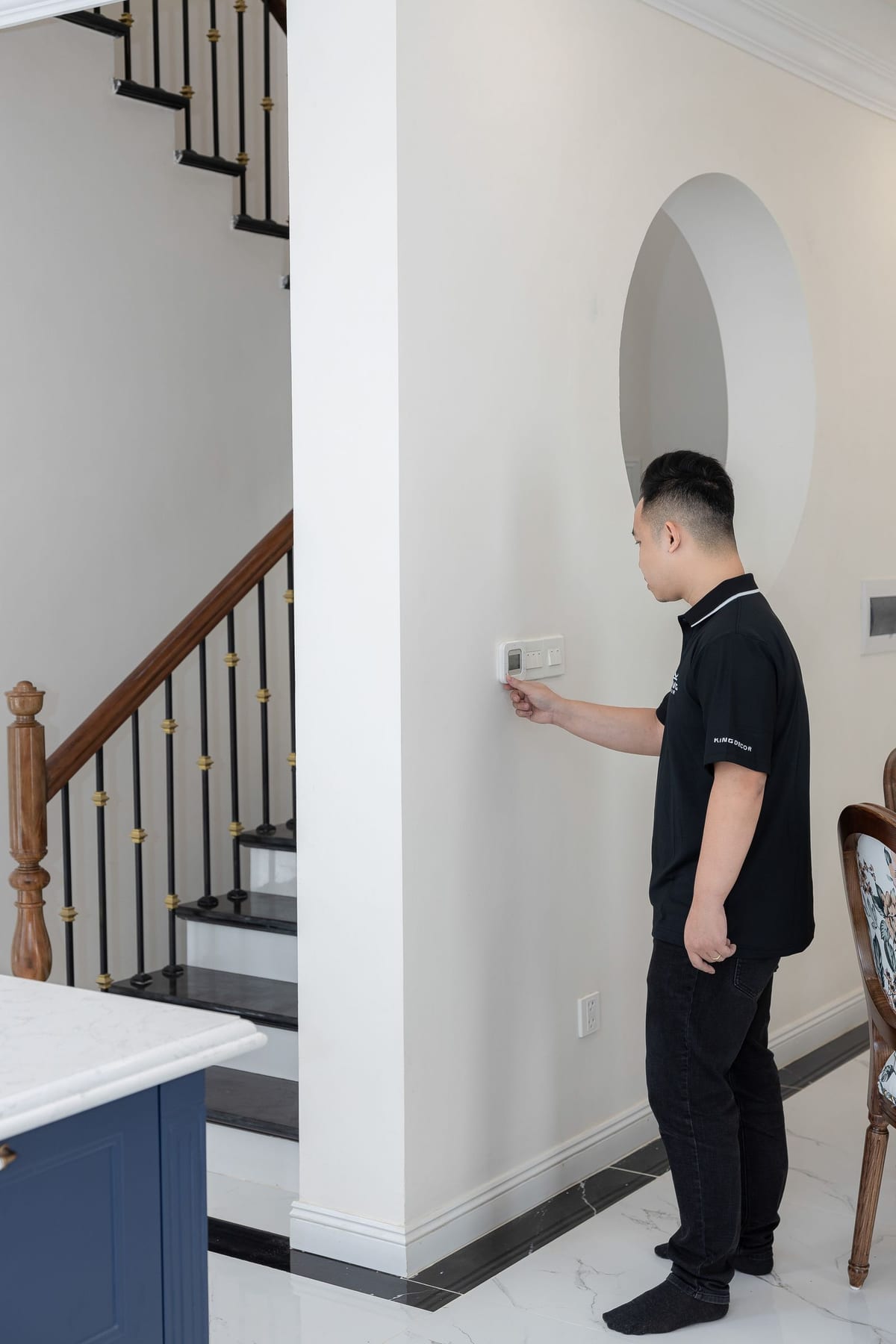 Homeowner checking comfort settings at home